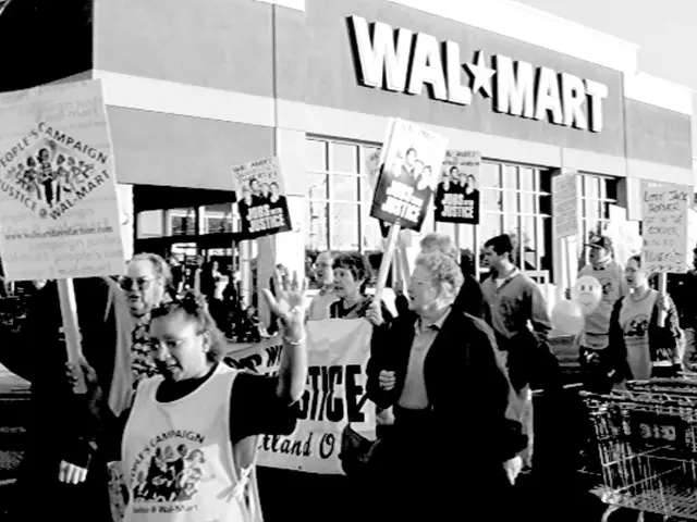 Protesting against corruption, the non-teaching staff of KSOU display banknotes in a ceremonial...