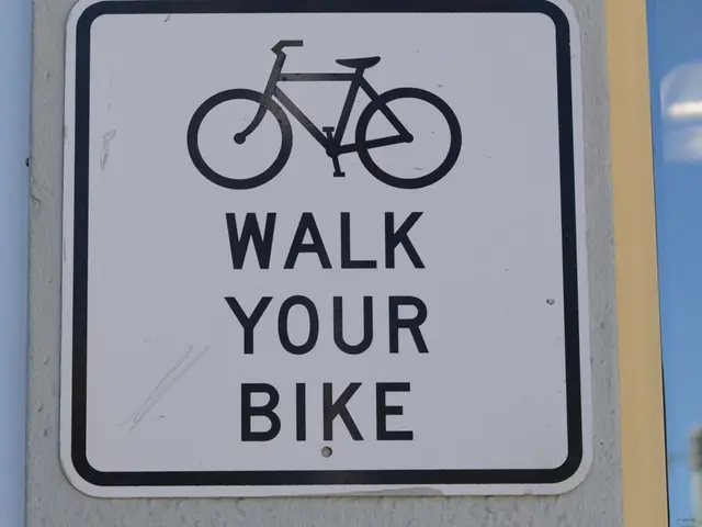 In this image there is a sign board with an image and text on it.