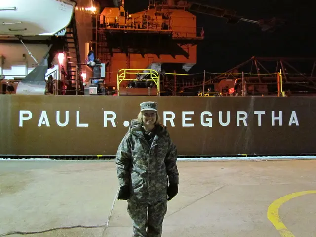 This picture shows a woman standing with a smile on her face. She wore a cap on her head and gloves...
